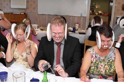family puts on a Halloween costume at a wedding