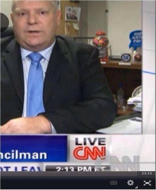 Is that a bottle of vodka under Doug Ford's desk during an interview? (council member of Toronto and brother to Rob Ford)