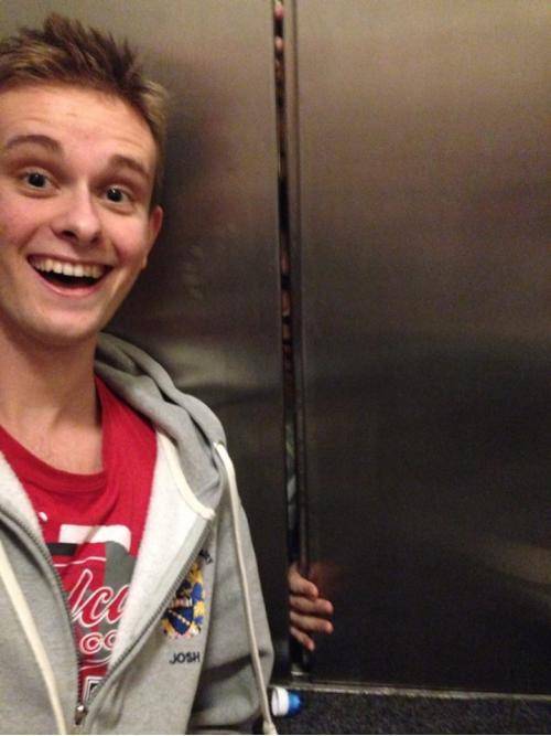 Taking a selfie with people trapped in the elevator.