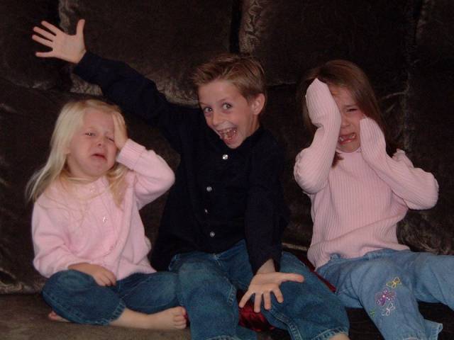When I was 7, my mom had us take Christmas Card pictures. My sisters wouldn't stop fighting, so I did what older brothers do best..