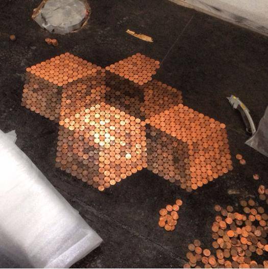 Using pennies to tile my bathroom floor. Here’s what I have so far.