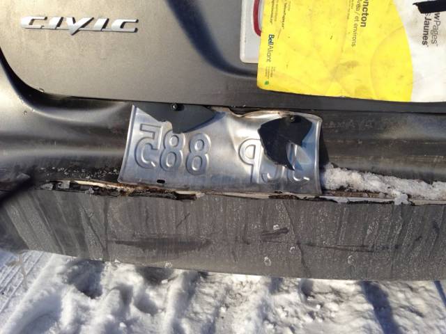 Is it Friday yet? Co-workers car is rear-ended in parking lot; Moron driver takes off without their license plate.