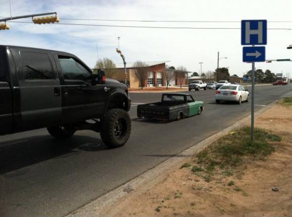 This old tiny truck is on the ground, and this new gigantic truck is lifted.