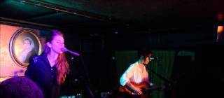 Singer flustered after realizing crowd is singing the band’s lyrics during their debut.