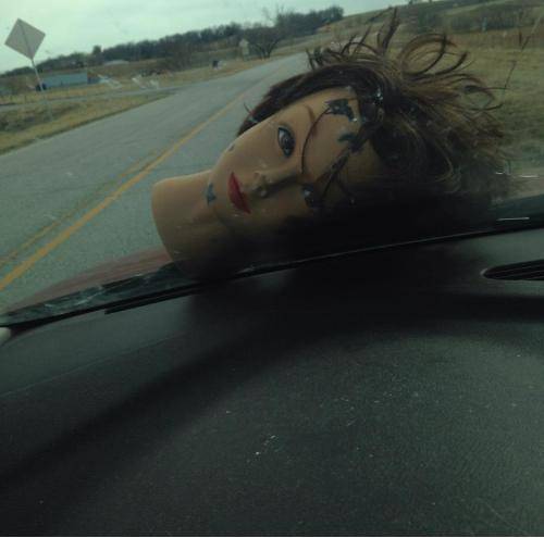 Friend was driving down the road behind a truck full of junk when this goddamned thing came flying out of the back and landed on her hood.