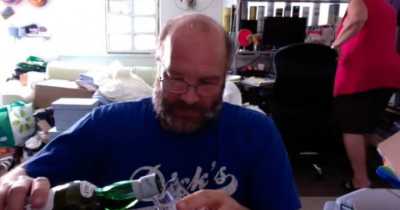 Man Reviews Scotch While His Wife Packs Her Things And Leaves Him In Background