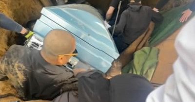Footage Captures Heartbreaking Moment Pallbearers Fall Into Grave As Son Is Trapped Beneath Father's Casket